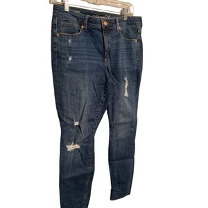 ⭐️ Mid Rise Skinny Darker wash blue jeans with distressed holes. Size 10/30R